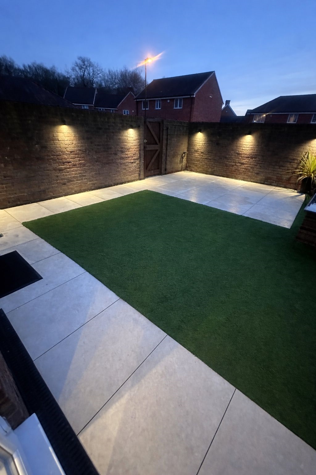 Rear garden re-level with porcelain paving by Cruise Construction