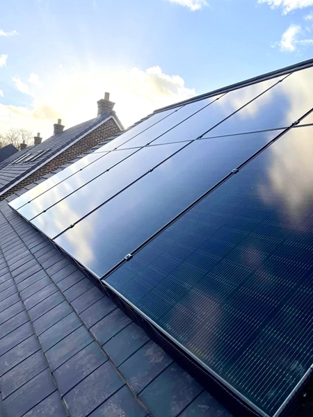Residential solar PV array installed on a slate roof